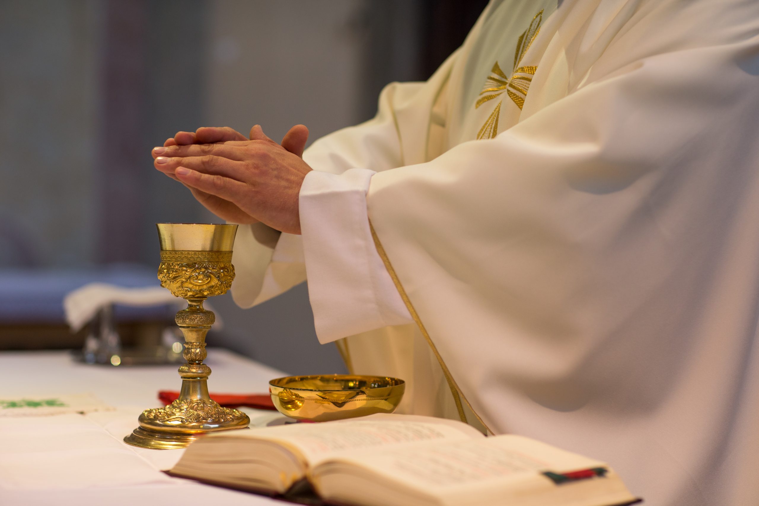What does it mean to be suspended "a divinis"?